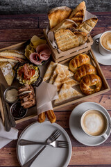 full breakfast with coffee, toast, croissants ready to eat