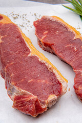 fresh raw piece of beef meat, striploin steak Marbled piece of meat Australia Grade A 
