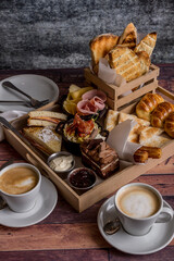 full breakfast with coffee, toast, croissants ready to eat