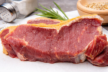 fresh raw piece of beef meat, striploin steak Marbled piece of meat Australia Grade A 
