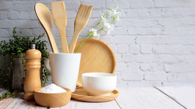 Kitchen Accessories In White Wooden Table And White Background And White Tableware With Salt In Wooden Bowl And Tree. Kitchen Minimal Cooking Time In Holiday Concept.