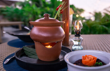 Asian style hot pot with candle in the restoran.