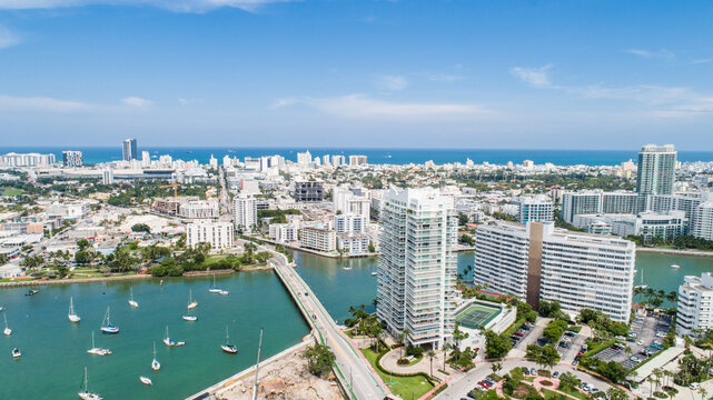 Aerial Venetian Island way bridge to South Beach in Miami, Florida. View of marina, sailboats and luxury highrise condos.