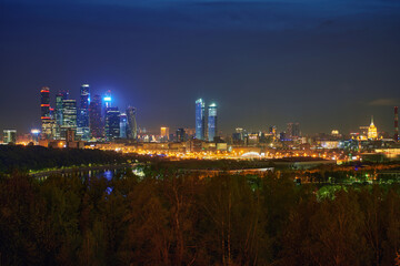 Night urban landscape panorama of Moscow with Moscow-city downtown business center with tall buildings. Cityscape of illuminated city. Moscow. Russia.