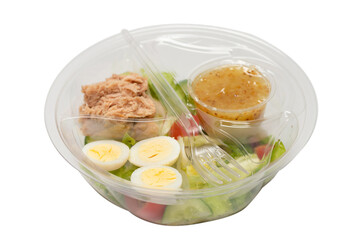Fresh tuna salad with lettuce, cucombers, cherries and eggs in plastic container.