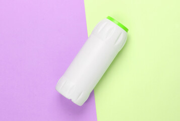 Bottle of cleaning product on colored background. Top view. Cleaning concept. Minimalism