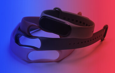 Smart bracelet with interchangeable straps in neon light