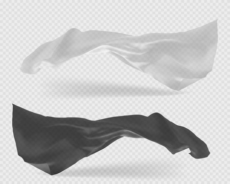 Beautiful flowing fabric flying in the wind. White and black wavy silk or satin.