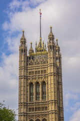 Fototapeta na wymiar Victoria Tower - largest and tallest (98 m) tower of Palace of Westminster. Palace of Westminster (or Houses of Parliament) located in City of Westminster, London.