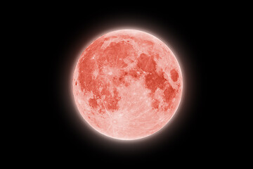 Full red strawberry supermoon halo glowing on black night sky background