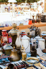 Vintage lamps and lanterns for sale at a street flea market