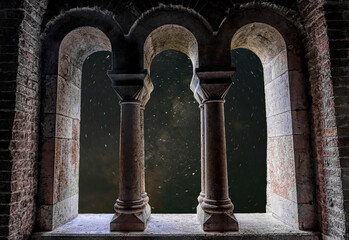 Stone arch window and starry night sky