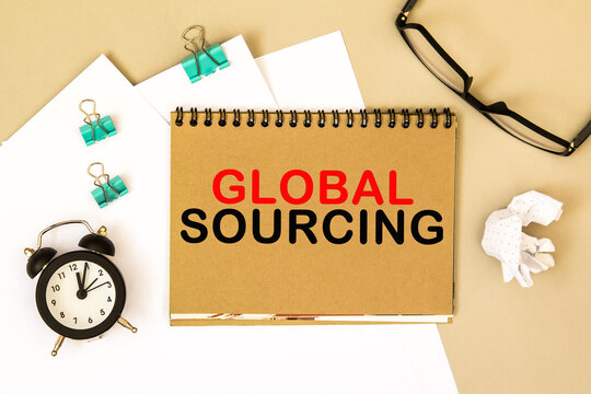 GLOBAL SOURCING .TEXT on a notepad, on a desktop. Business, finance, image.
