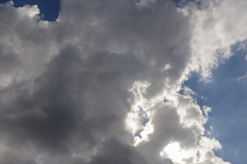 Large rain clouds in the sky obscure the sun