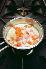 Ingredietns to preparing the cod fish fillet with orange soup with sweet potatoes and other tasty vegetables - photo from above.