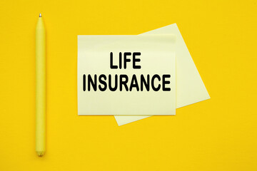 life insurance. Yellow pen and stickers on a yellow background
