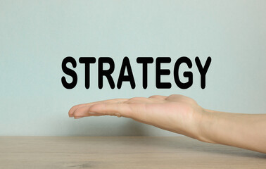 strategy. hand on a blue background. Business, financial, marketing concept.