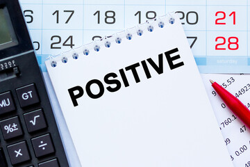 POSITIVE. The calculator, kalendar, notebook with the text on the financial table. Business, Financial concept