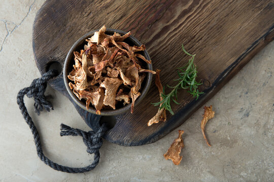 a bowl of dried chanterelle mushrooms on the table