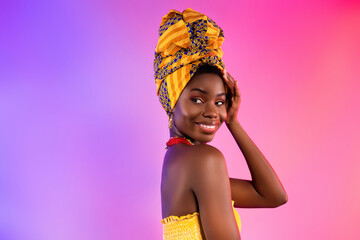 Photo of charming nice afro american lady smile look empty space wear turban isolated on abstract...