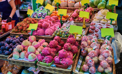 Stall of organic vegetables and fruits at a farmers market. Selling organic fresh agricultural product at farmer market.