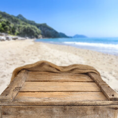 Fototapeta na wymiar Wooden desk of free space and summer beach 