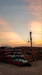 Crane with barrels of oil at a cargo port area in Kennedy Town hong Kong