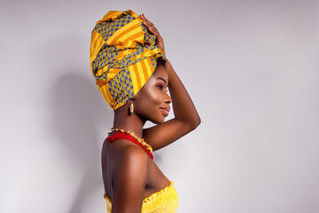 Profile side photo of afro american lady look empty space hold hand wear turban isolated on grey...