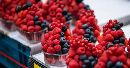 Colorful ripe berries assorted mix of strawberry, blueberry and raspberry. Background of fresh...