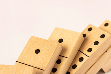 A game of dominoes on a light background. Close-up. Selective focus.