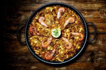 Spanish seafood paella in traditional pan