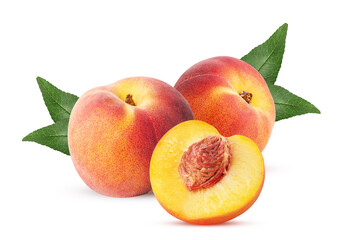 Fototapeta na wymiar Two ripe peach fruit one cut in half with bone and leaf