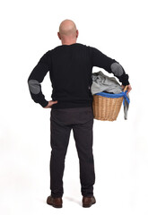 rear view of a man with a basket of dirty clothes on white background