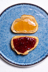 Honey, raspberry jam and peanut butter on white bread