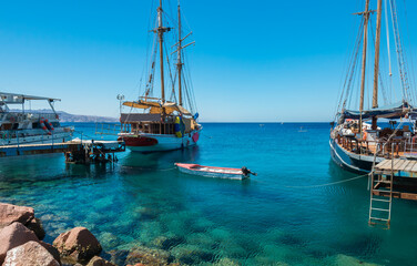 Moored pleasure boats, sailboats and yachts in marina of Eilat - famous resort and recreation city in Israel