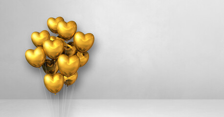 Gold heart shape balloons bunch on a white wall background. Horizontal banner.