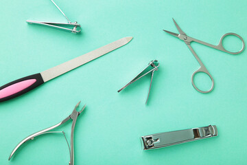 Tools of a manicure set on mint background