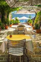 BUDVA, MONTENEGRO - 9 AUGUST, 2019: Restaurant with flowers in the old town of Budva, Montenegro