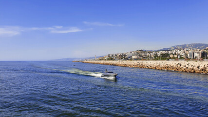 Obraz premium Boat in the bay. Holiday vacation with family and friends. Speed boat cruising