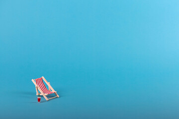Beach chairs isolated on blue background