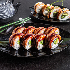 fresh and tasty sushi on the black background