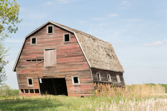 close up of an old faded red barn 