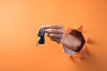 Hand holds car keys