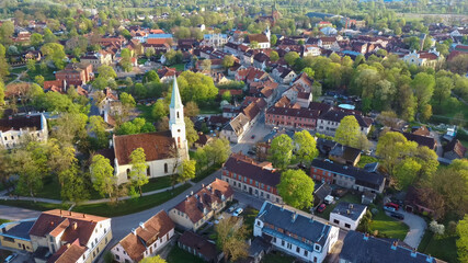 Fototapeta na wymiar Aerial View of Kuldiga Old Town With Red Roof Tilesand Evangelical Lutheran Church of Saint Catherine in Kuldiga, Latvia.