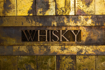 Whisky text on textured copper and gold background