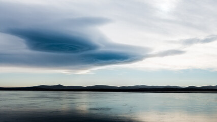 Gate - beautiful sky overa frozen lake