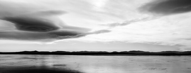 Gate - beautiful sky overa frozen lake