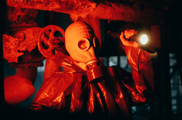 Scientist dosimetrist radiation supervisor in protective clothing and gas mask explores the danger...