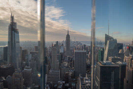 Fototapeta United States, New York, the empire state building seen from the window of Top of the Rock
