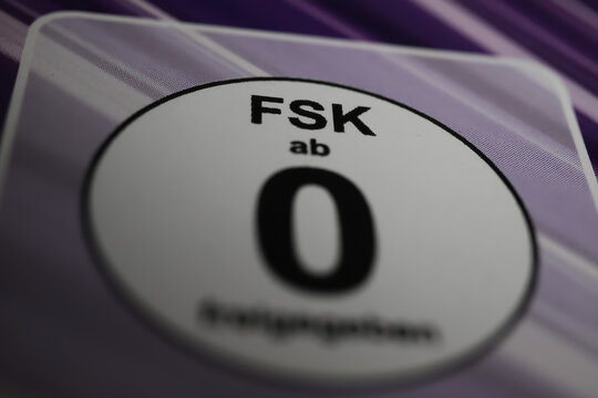 Viersen, Germany - May 9. 2021:  Closeup of isolated german FSK rating logo movie relased without age restriction (focus on center of letter S)